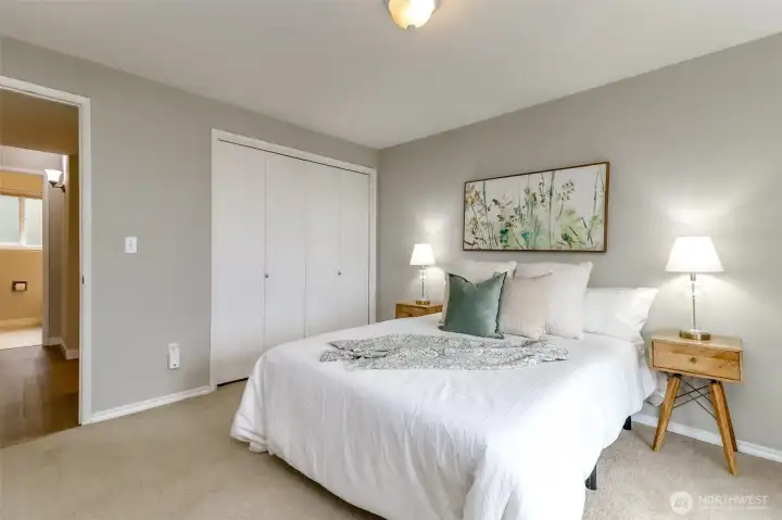 Primary bedroom this view faces the full bathroom across the hall.