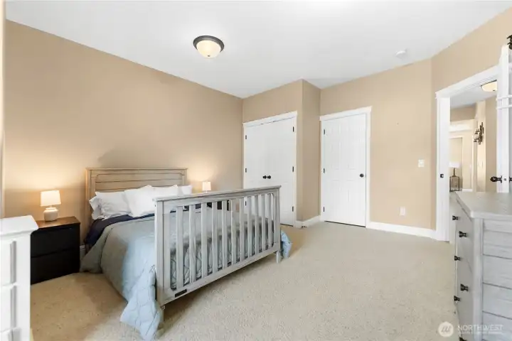 View of mainfloor bedroom with closet & door to bathroom