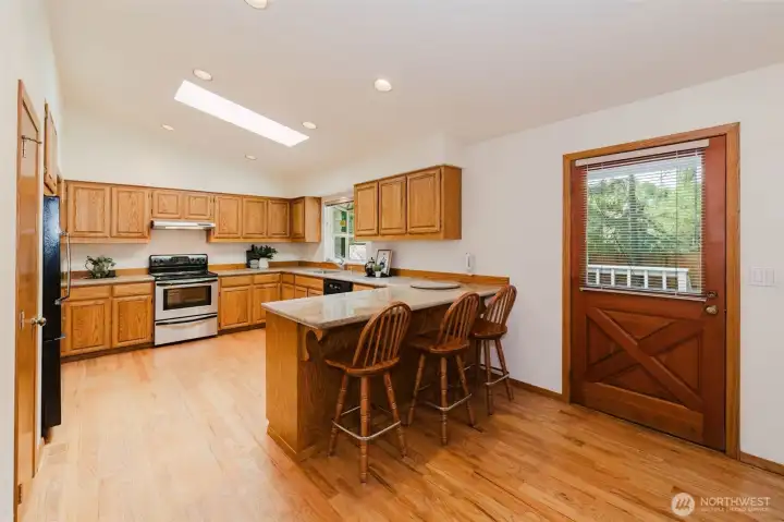 breakfast bar with updated kitchen granite countertops