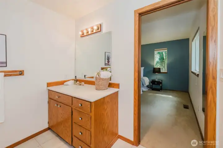 Laundry chute in primary vanity under the sink