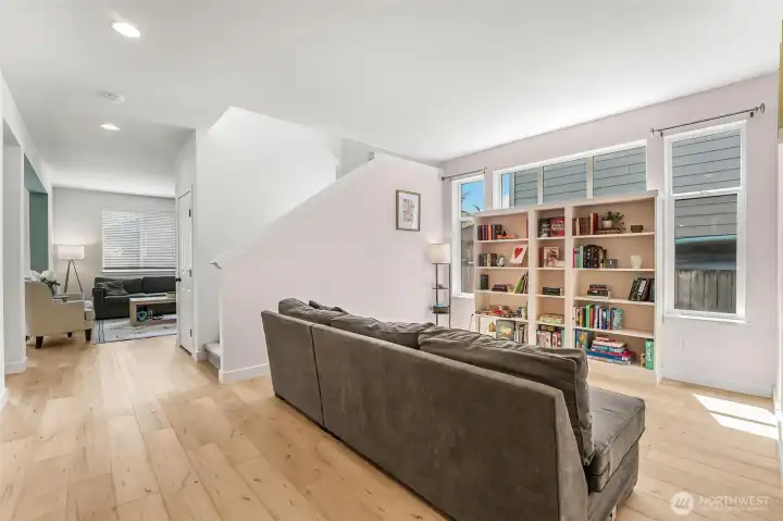 Open living room with custom shelving. Open living room with custom shelving.