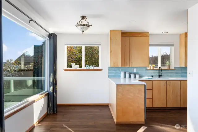 Kitchen has new countertops, backsplash and appliances.