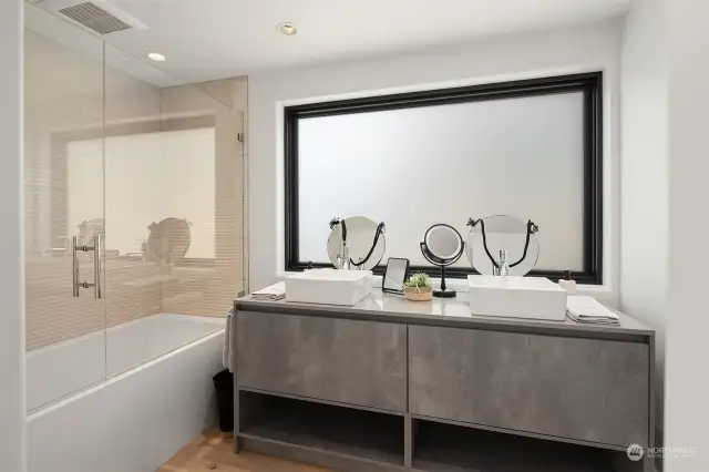 Attached bath - all of which in the house have pental quartz vanity tops and cohesive tile / vanity finishes.
