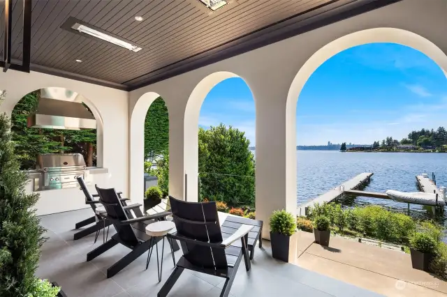 Relish year-round waterfront views from the covered living area, complete with a built-in BBQ for ultimate outdoor enjoyment.