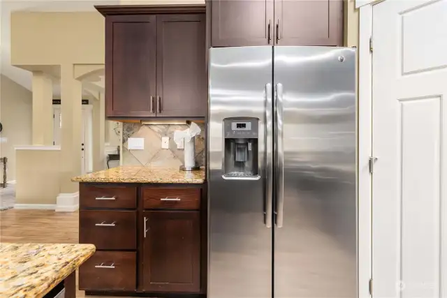Walk in panty, stainless steel fridge and extra storage are all of those convenient luxuries