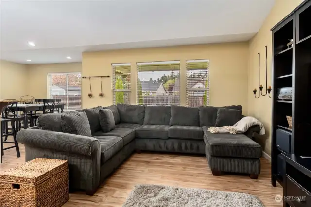 Living area has great views of the backyard and also allows for easy conversations into extra dining space