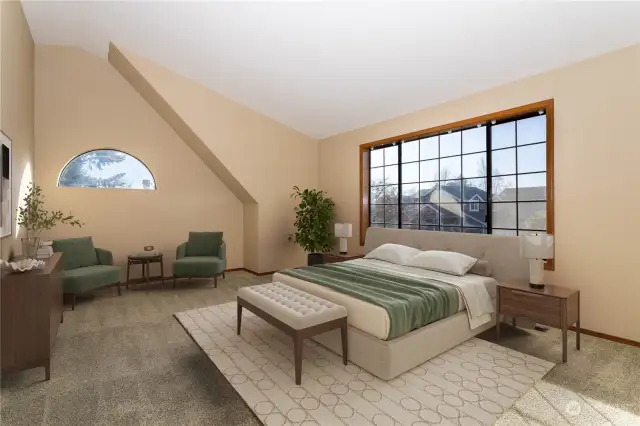 Virtually Staged - Primary bedroom with vaulted ceiling & abundant natural light, plus ceiling fan.