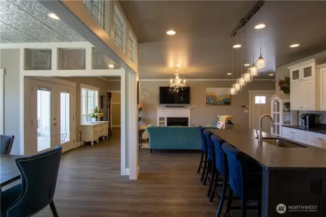 Open concept Kitchen and Family room with formal dining area attached with craftsman hand made leaded glass.