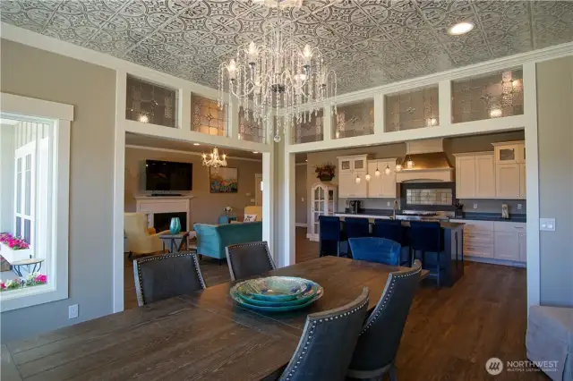 Formal Dining area with tin ceiling and fountain chandelier.