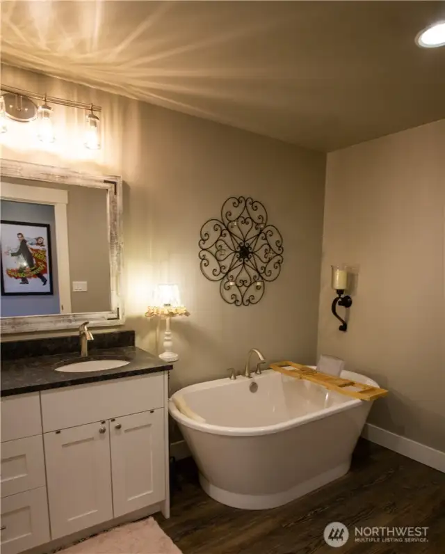 Upstairs guest bathroom soaking tub.