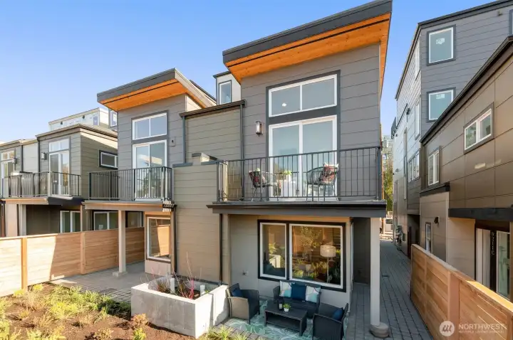 Welcome to Clover. Contemporary design and natural tones come together in this brand-new modern home with striking curb appeal.
