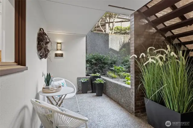 Catch a few rays of afternoon sun and relax with your favorite beverage in this secluded area. There's even your own storage locker discreetly tucked away under the stair!