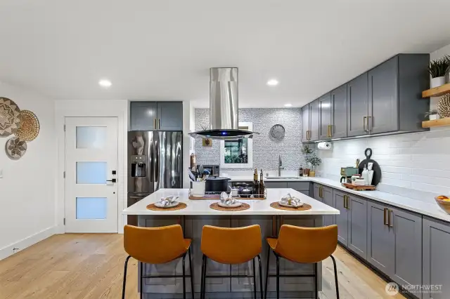 The island counter seating delivers an ideal gathering place.
