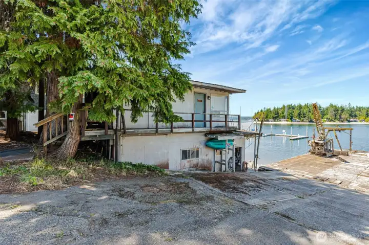 The west boathouse with the office, power room. The old rail system into the lower part was capable of pulling in 50' boats when the yard was operating. The wench is still there.