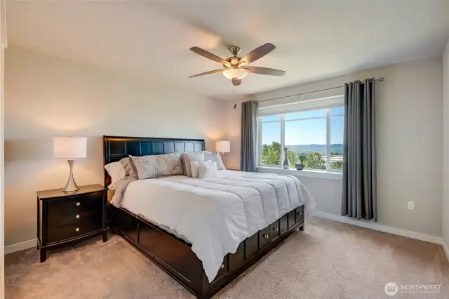 Wake up to stunning views from the primary bedroom.