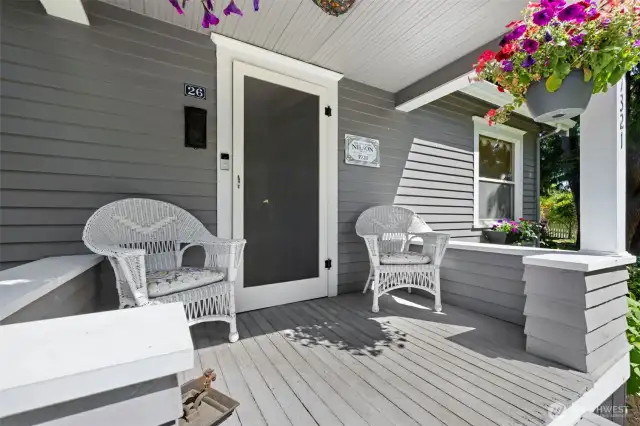 Inviting covered front porch sets the stage for this historic 1920s gem—perfect for morning coffee or evening unwinding.