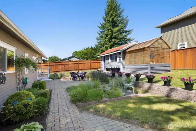 The topiary is just one of many thoughtful touches that make this garden feel like home.
