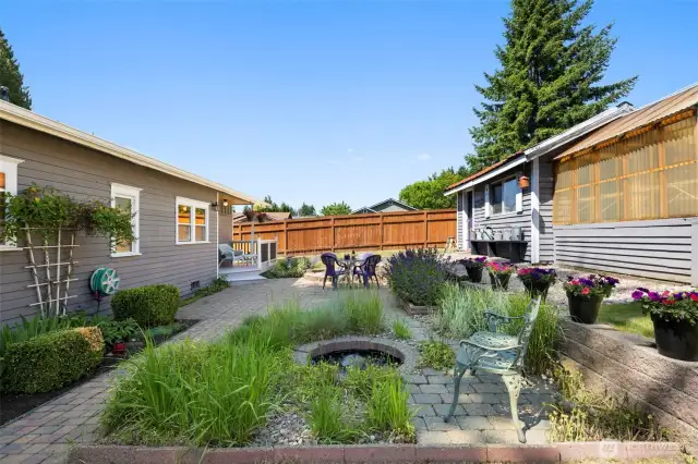 A tranquil pond adds beauty and calm to this storybook backyard.