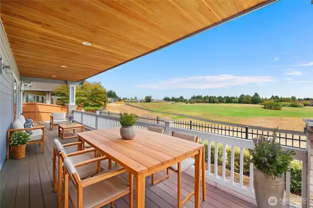 Large covered Trex Deck with stunning territorial and 3 Fairway views. All complimented by a paved patio and side yard sitting area.