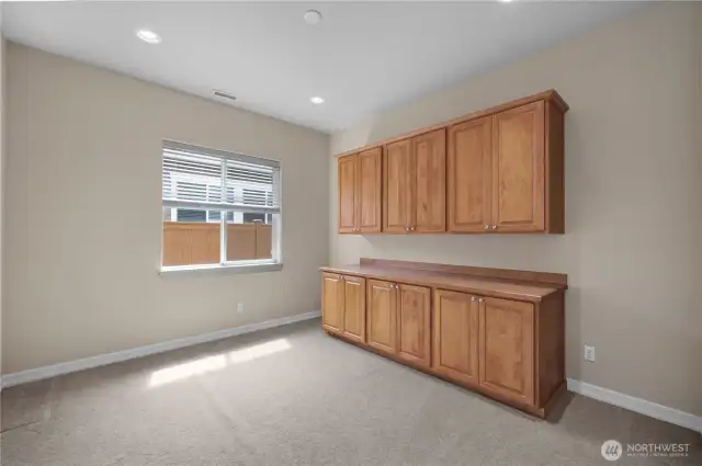 3rd Bedroom/Flex Space with large closet and custom built-in shelves.
