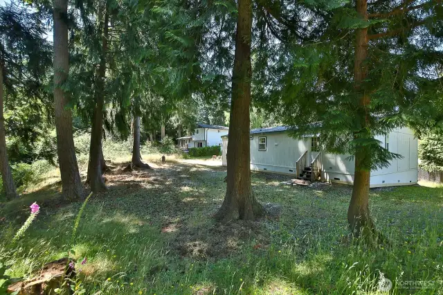 Home is adjacent to private acreage creating a backdrop of privacy and natural beauty.