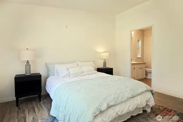 Full Primary Bath through the open door. Your back is to the closet.