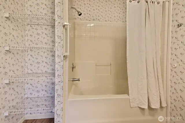 Full bath. Note the additional shelving for storage.