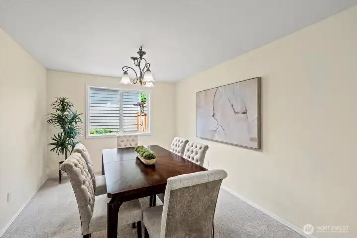The formal dining room is conveniently located between the living room and kitchen