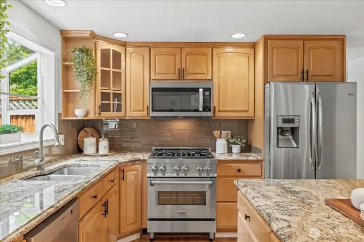 You will love cooking on the natural gas range and entertaining in this kitchen