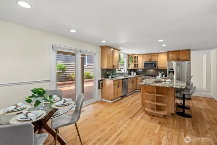 From the kitchen, there is direct access to the back patio & ADU
