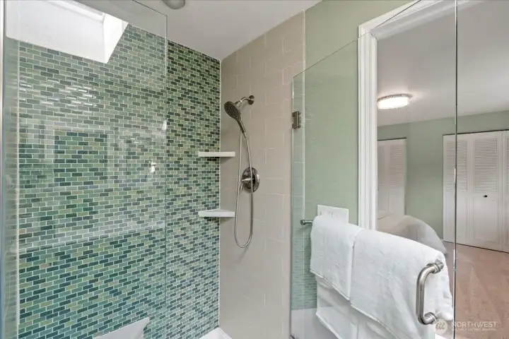 Beautiful tiled shower and glass shower door