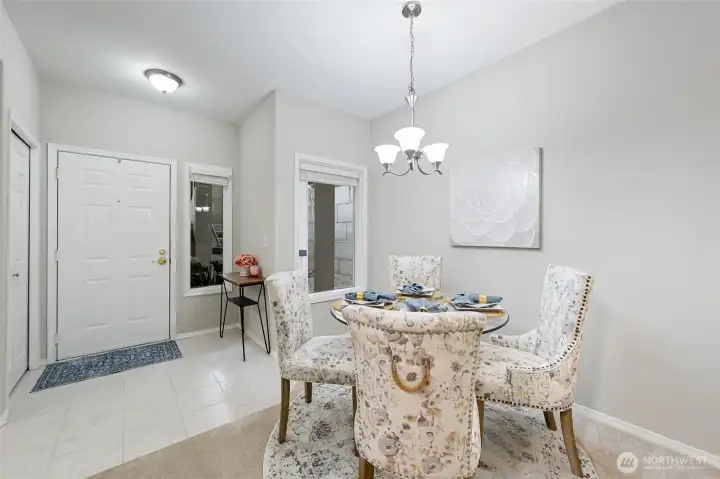 From the Dining Room looking toward the entry we're able to see the coat closet and how wide the entry is.