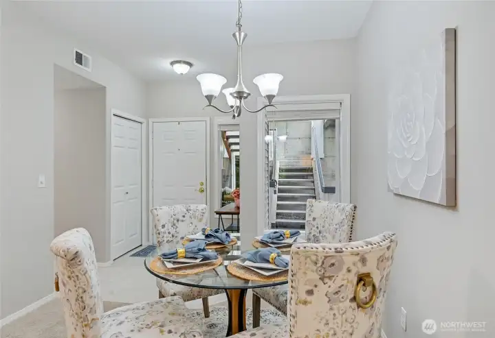 Another look at the Dining Room toward the entry. The hallway to the left leads to the Kitchen, laundry, full bathroom, and second bedroom. Let's go explore the Living Room first.