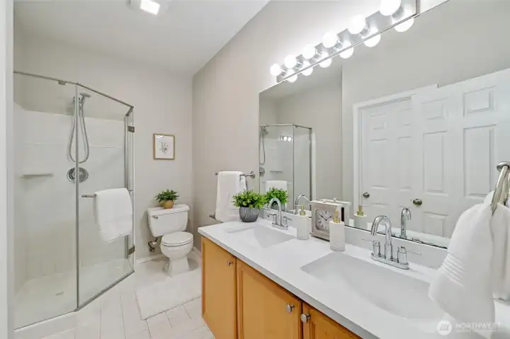 Gorgeous Primary Bathroom with new quartz countertops with double vanity. Good sized step in shower to get you going in the mornings.