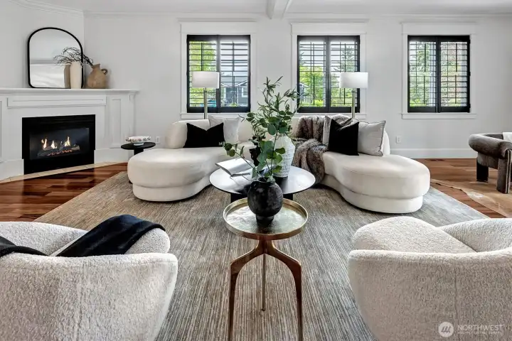 Expansive Great Room features a gas burning fireplace, walls of windows and French Doors leading to a private deck.