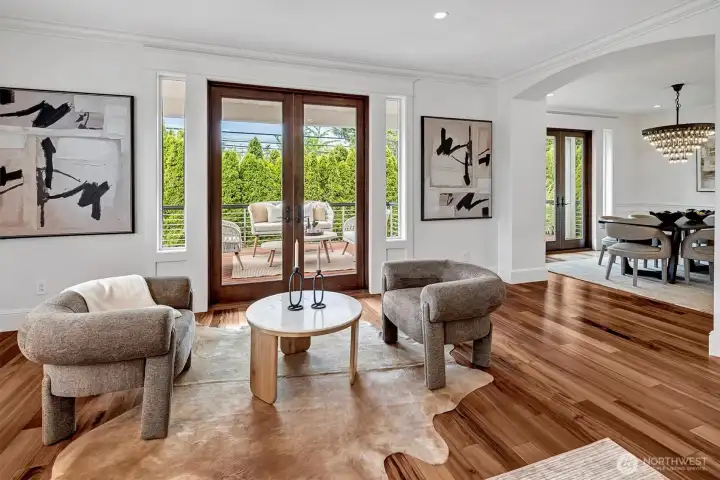Gorgeous French Doors lead off the Great Room to your private Ipe deck surrounded by gorgeous landscaping and a flowing fountain.