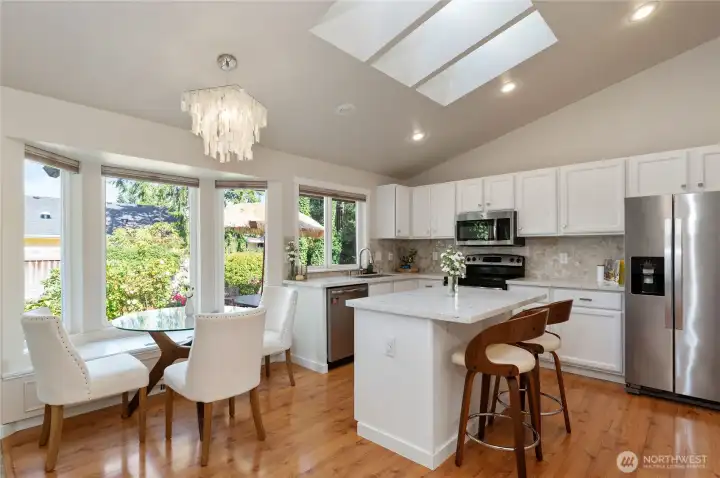 The updated kitchen with bright quartz countertops, stainless appliances, and tons of natural light.