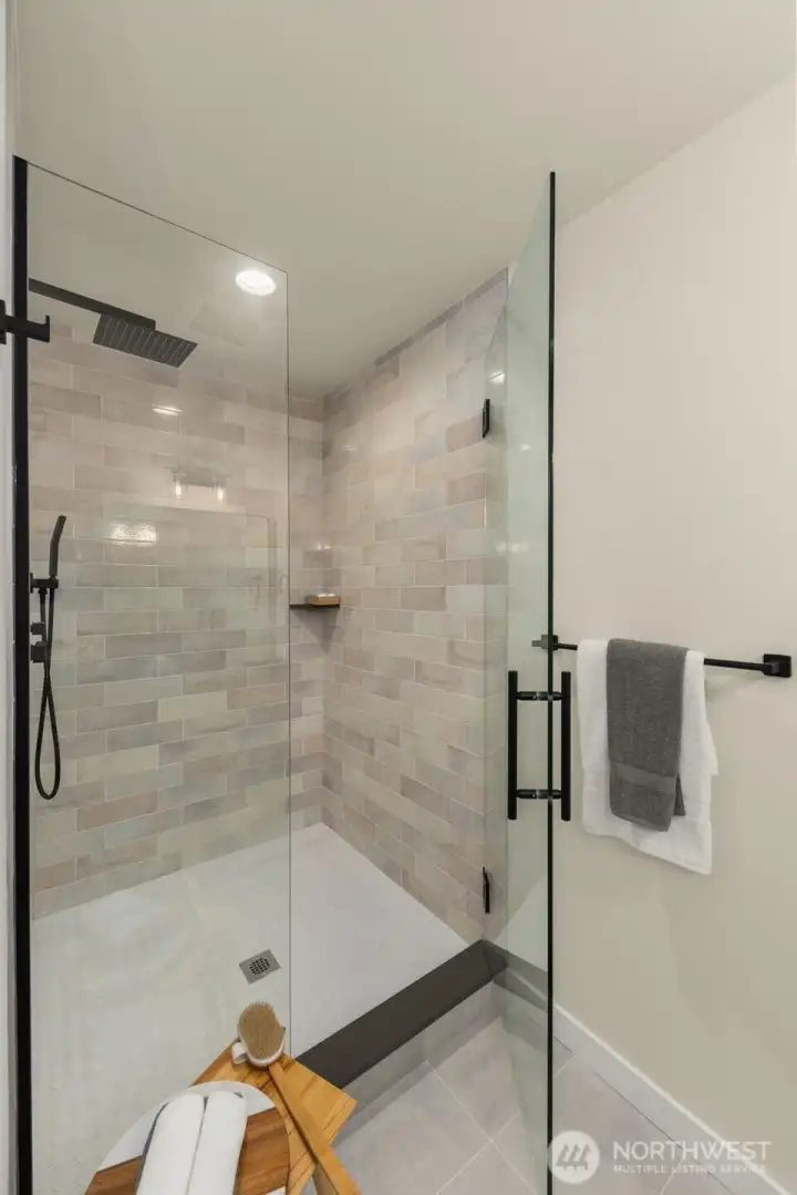 Indulge in the rain shower experience surrounded by beautiful tile and sleek finishes — a refreshing daily ritual reimagined in style.