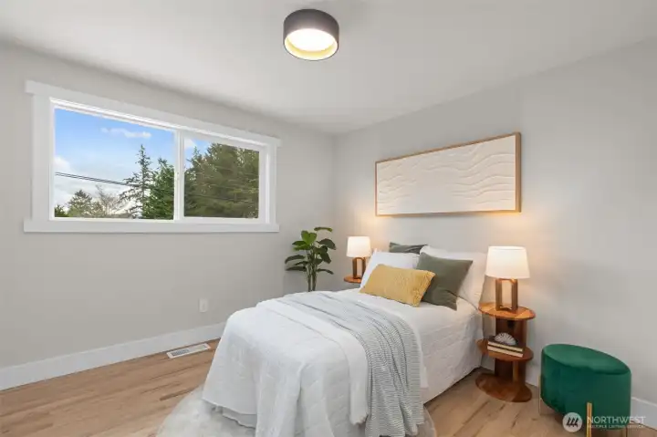 Bright secondary bedroom with partial views and flexible use potential.