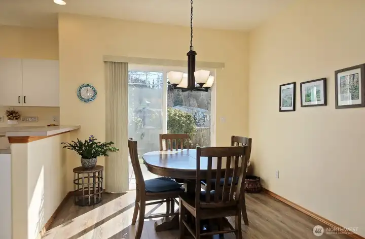 Open dining area with sliding doors to the patio.