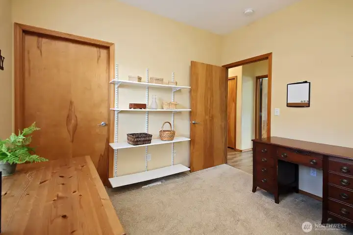 The door on the left is a walk-in closet in the guest bedroom.