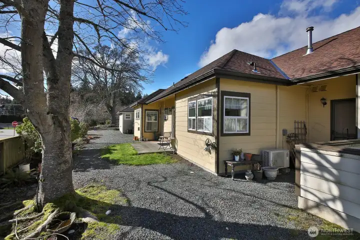 The backyard has a door into the garage.