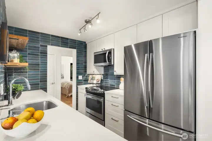 Stunning space with Quartz counters, generous undermount sink and great storage.