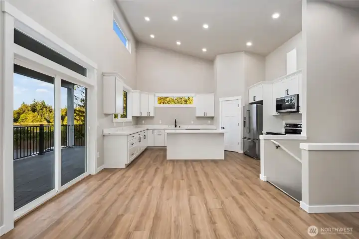 Sleek finishes throughout, expansive windows frame stunning lake views.