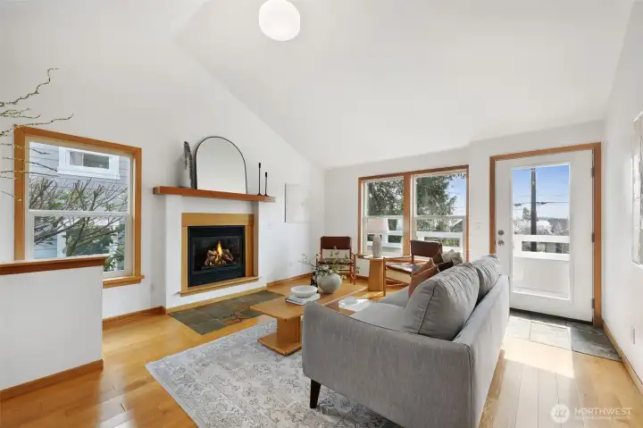 A cozy gas fireplace & slate hearth adds ambiance for comfortable, chill nights at home.