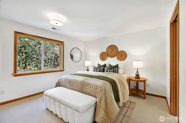 The upper level primary bedroom enjoys great privacy, overlooking the back yard and just separate enough from the living areas and the other bedrooms.