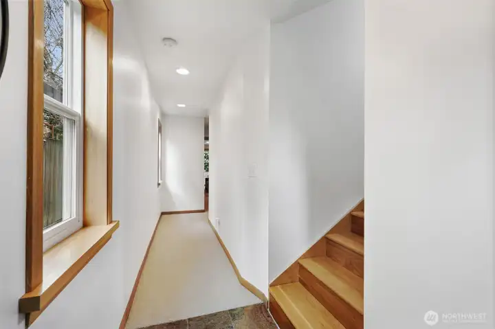 Head downstairs to check out even more space, garage access, and your private backyard! (But don't miss the walnut wood inlay on the stair landing!)