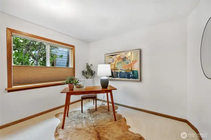 One of two downstairs bedrooms: great as a home office, or a perfect nursery thanks to blackout blinds.