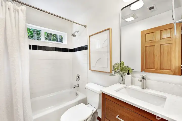 Full bathroom on the lower level with brand new vanity.