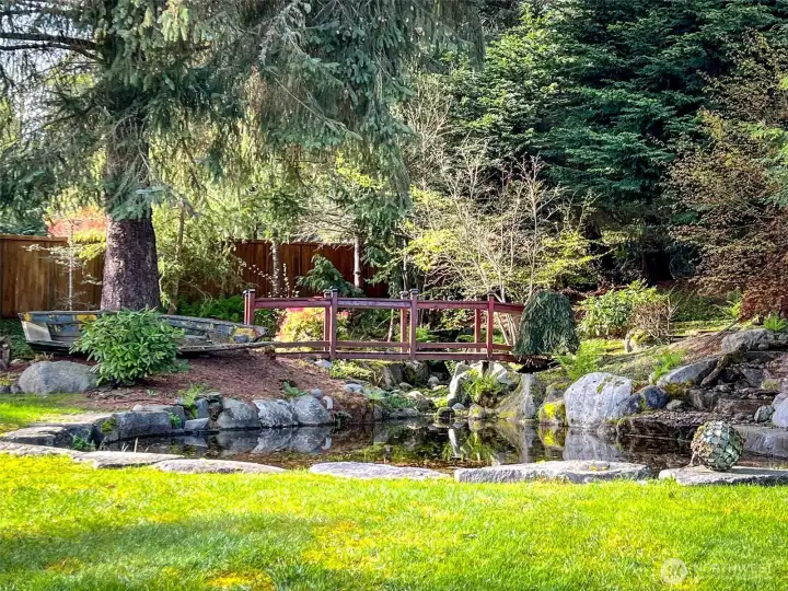 The picturesque waterfall and pond in the back yard blends into the natural scenery.